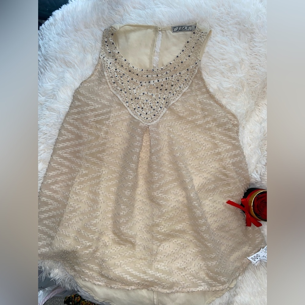 Beige sleeveless blouse